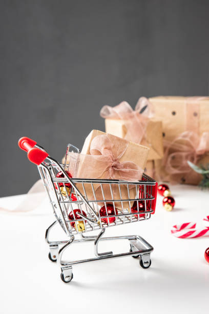 istock Christmas shopping cart, small gift boxes 1184131349