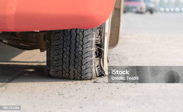 Burst Tire On The Road Stock Photo - Download Image Now - Flat Tire, Tire - Vehicle Part, At The Edge Of