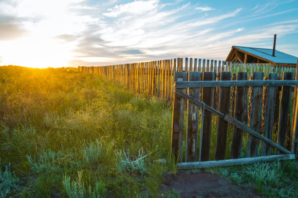 landscape with wooden fence at sunset