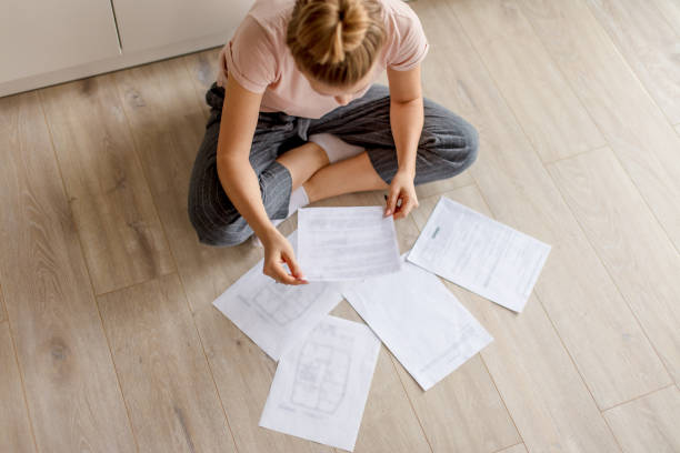 istock young housewife spending tome on paper 1184132529