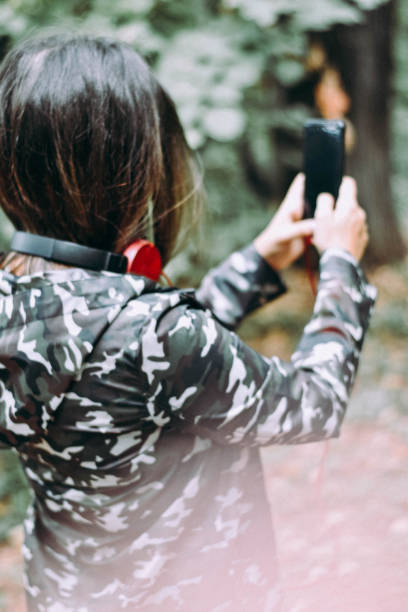 istock Young Female Listening Music Using Smartphone 1184133644