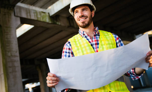 istock Picture of construction site engineer looking at blueprint 1184134259