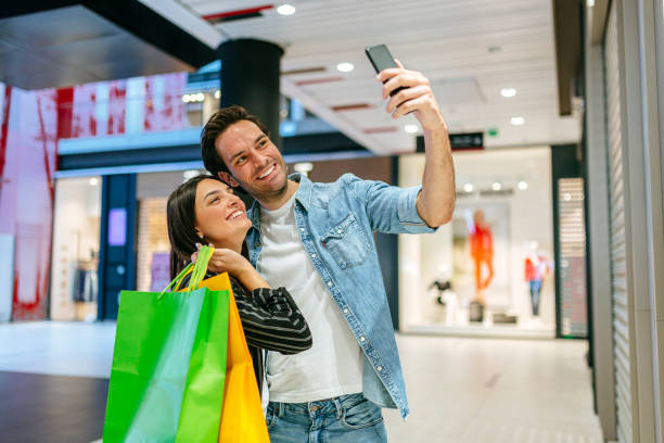istock Young couple shopping in the mall 1184136892