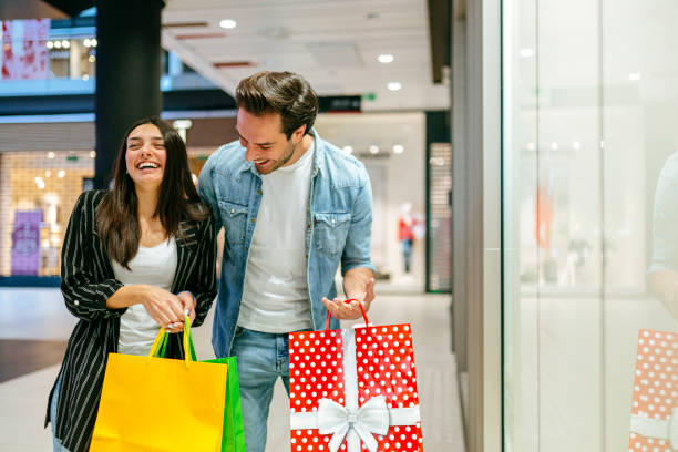 istock Young couple shopping in the mall 1184137578