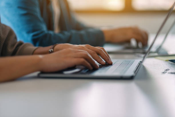 istock businessman using and working on laptop computer together in office 1184137763