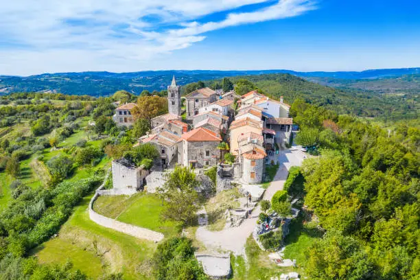 Beautiful old town of Hum on the hill, traditional architecture in Istria, Croatia, aerial view from drone