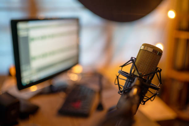 istock Condenser microphone golden close-up shot in the studio recording 1184138185