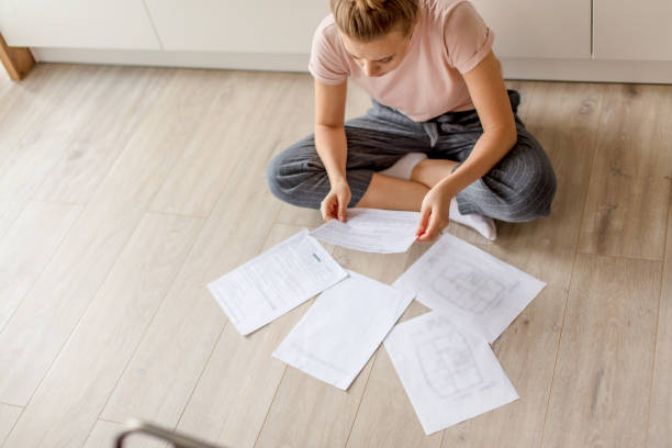 istock top view. young girl concentrated on paper work 1184138490