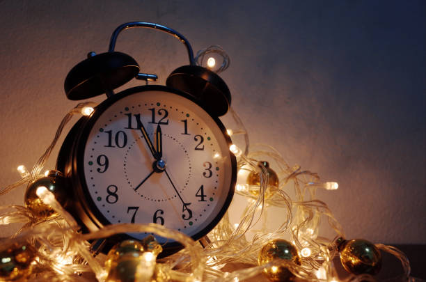 istock New Year alarm clock with vintage gold shining 1184139483