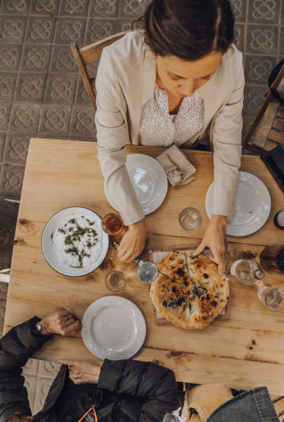 istock Family having pizza at a restaurant 1184141095