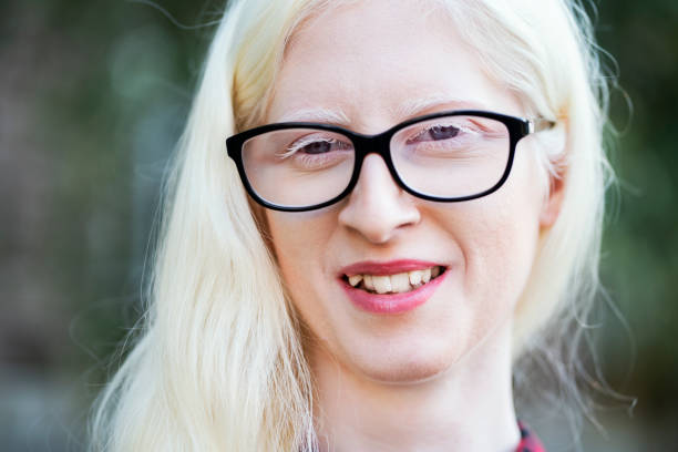 Portrait of a young beautiful blonde woman in eyeglasses.