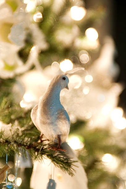 istock Christmas decorations hanging in green xmas tree 118414305