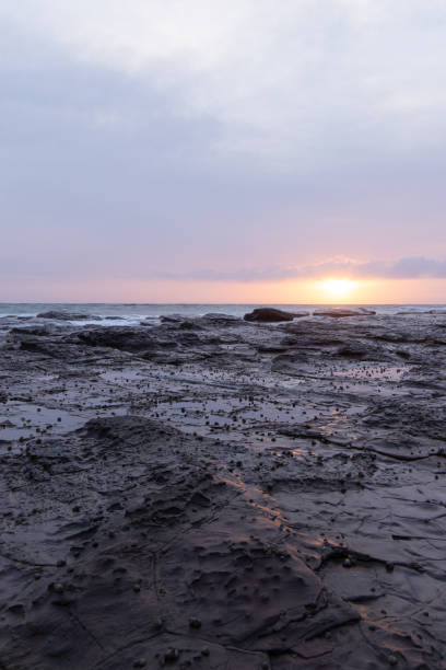 istock Rock formation and overcast sunrise 1184143907