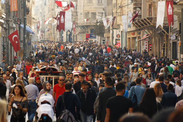 City crowd at Istiklal Avenue Beyoglu, Istanbul / Turkey - October 20 2019: People crowd walking through Istiklal Avenue which is the most famous and crowded street of Istanbul on Sunday. populism stock pictures, royalty-free photos & images