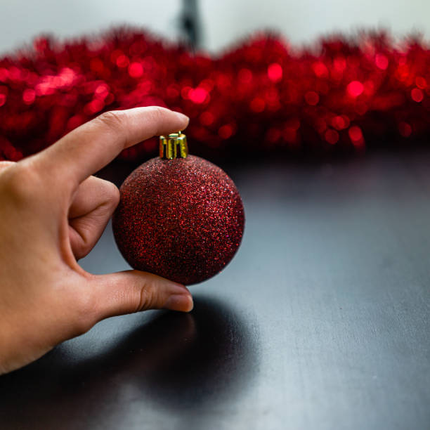 istock Hand holding a glittery Christmas ball. Christmas concept. 1184149936