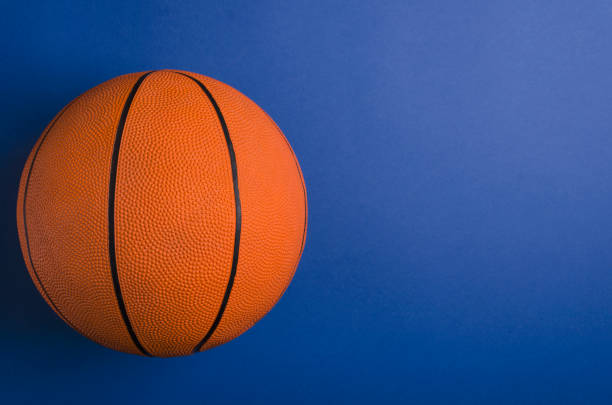istock Top view of basketball on the blue surface.Empty space for text 1184150889