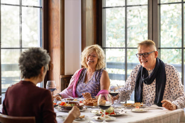 istock Senior Friends Talking In Restaurant 1184152239