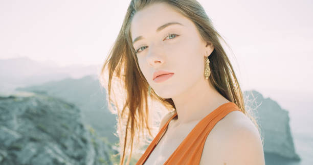 istock Young girl posing on the mountain top 1184153237