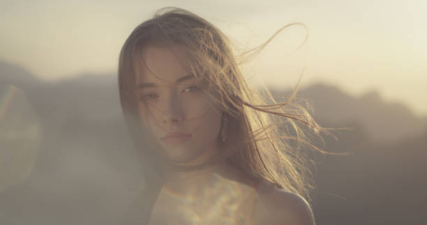 istock Young girl posing on the mountain top 1184153976