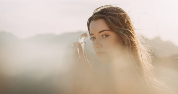 istock Woman's head with a healing crystal 1184154059
