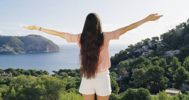 istock Girl enjoys the view from the terrace 1184156546