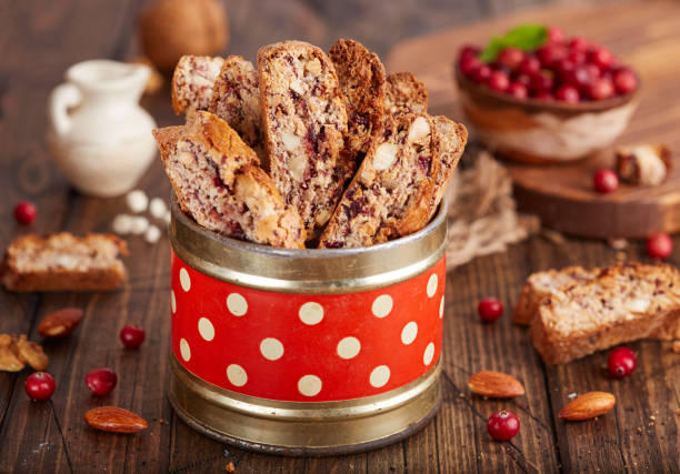 delicious homemade biscotti with almond, walnuts and cranberry. - biscotti imagens e fotografias de stock