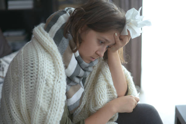 istock young girl is sick in the room 1184163108