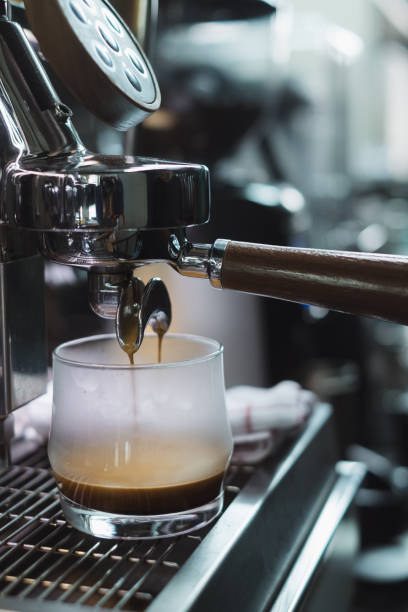istock Close-Up of coffee machine making a cup of coffee. 1184163758