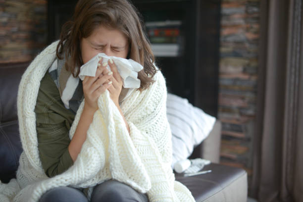 istock young girl is sick in the room 1184163857