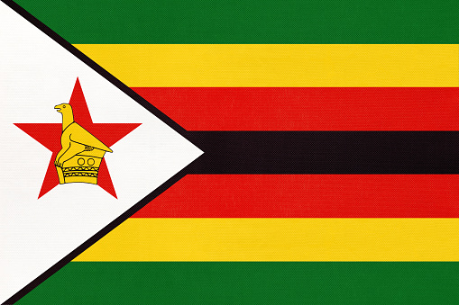 Republic of Zimbabwe national fabric flag, textile background. Symbol of international world African country. State zimbabwean official sign.