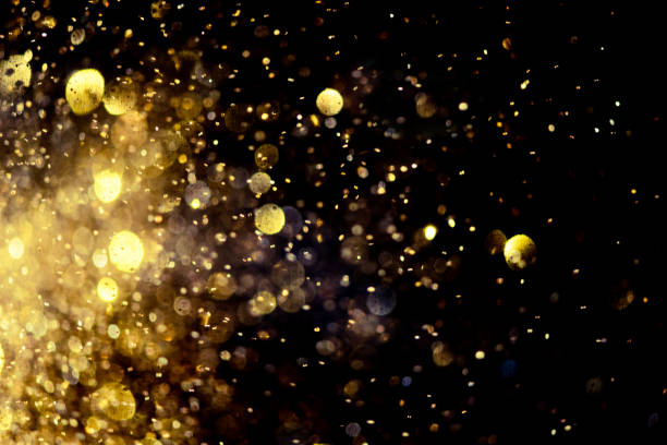 istock golden glitter bokeh lighting texture Blurred abstract background for birthday, anniversary, wedding, new year eve or Christmas 1184171071