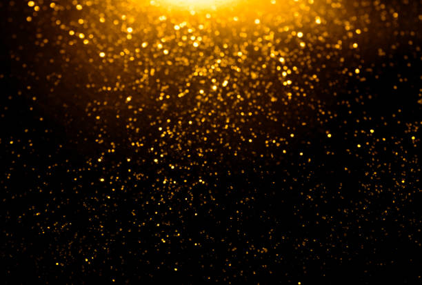 istock golden glitter bokeh lighting texture Blurred abstract background for birthday, anniversary, wedding, new year eve or Christmas 1184172923