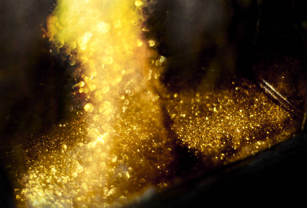 istock golden glitter bokeh lighting texture Blurred abstract background for birthday, anniversary, wedding, new year eve or Christmas 1184173120