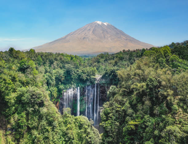 istock Waterfall, volcano and tropical rainforest in Indonesia 1184175477