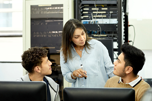 Professor Computer Learning Center Professor Explaining Students In Computer Lab Stock Photo - Download ...