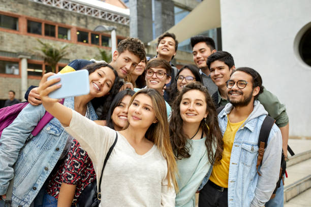 istock Friends taking selfie outside university 1184177165