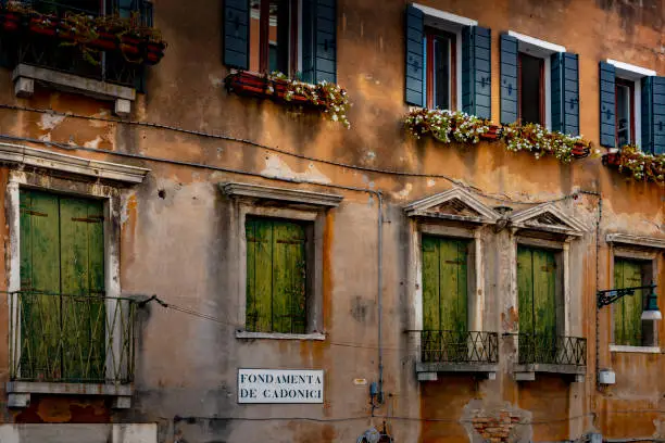 Photo of Old buildings on the side of a canal in Venice