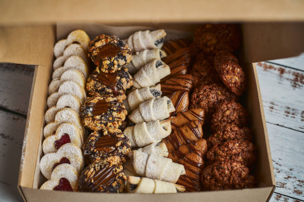 istock Opened box of various mini Christmas pastry 1184179459