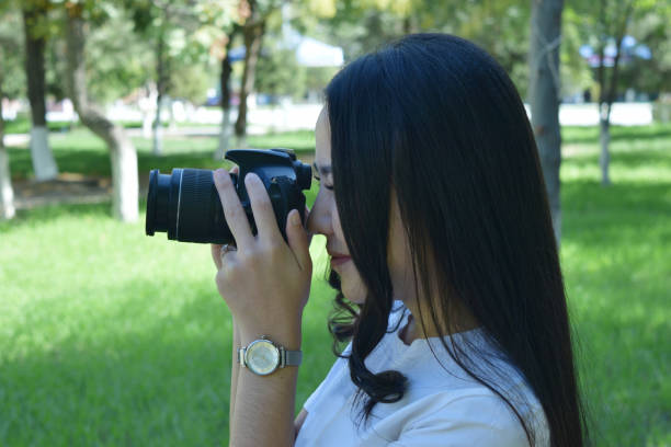 istock girl with photo camera 1184180570