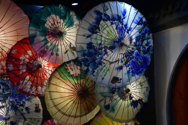 istock Red, blue and yellow open Chinese umbrellas photographed from below 1184181047