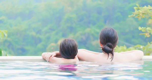 istock asian family enjoy hot spring 1184182411