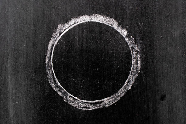 istock White chalk hand drawing in circle or round shape on black board background 1184182457