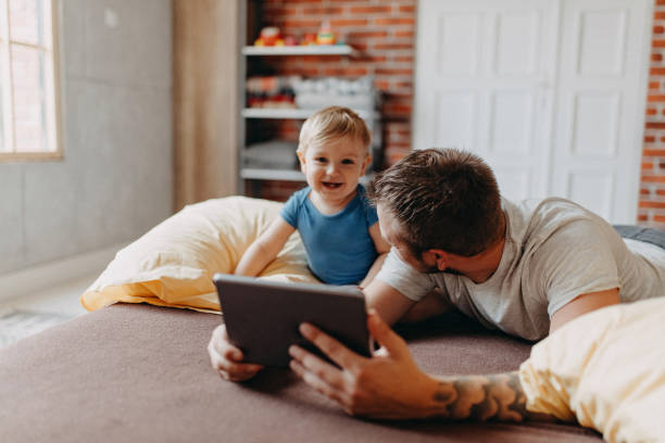 istock Father and son playing in morning 1184183327
