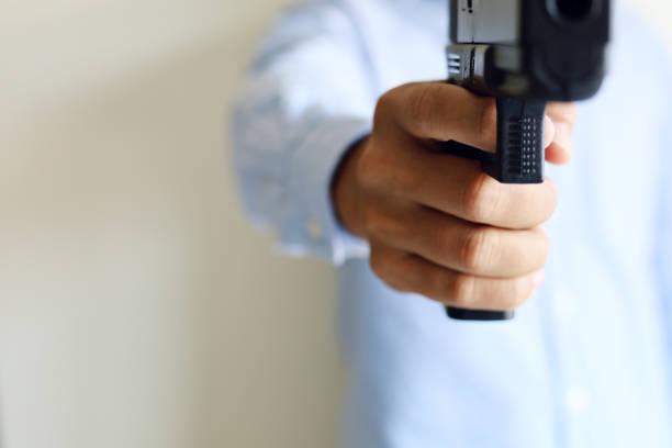 istock Close-up Man holding gunman concept. 1184183408