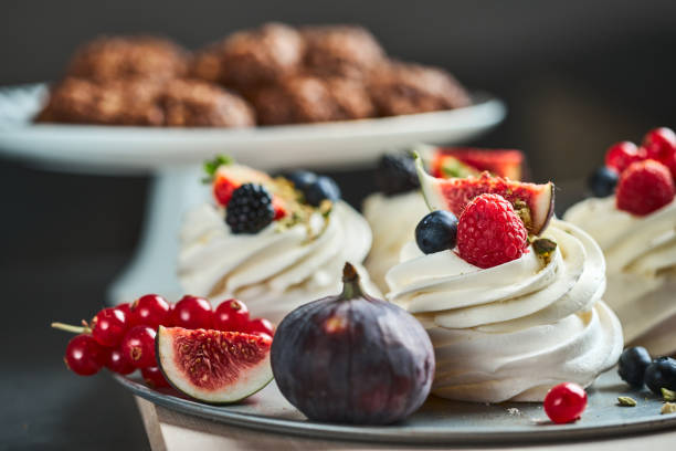 Mini Pavlova cake meringue dessert decorated with berries