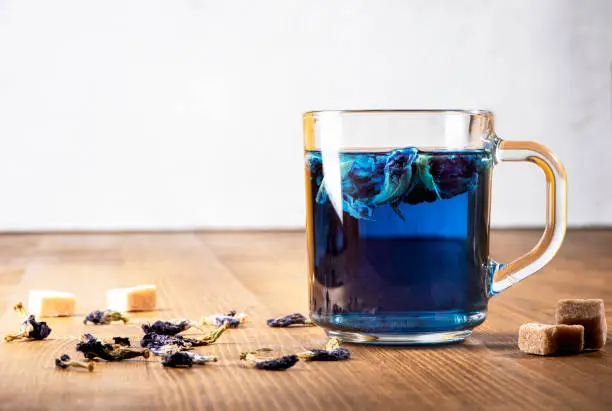 Photo of Organic blue Anchan tea in a transparent glass cup