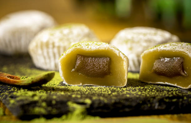istock Sliced green mochi with filling close-up. 1184183623