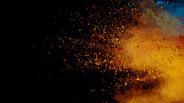 istock Explosion of colored powder isolated on black background 1184184802