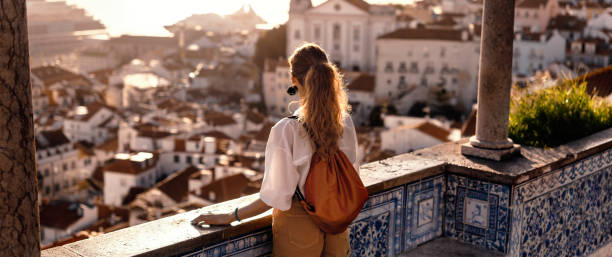 Young women exploring streets of southern Iberic european city Scene with a female tourist who is walking on the street of Iberic city and poses in a famous, most recognizable places with breathtaking view andalusia stock pictures, royalty-free photos & images