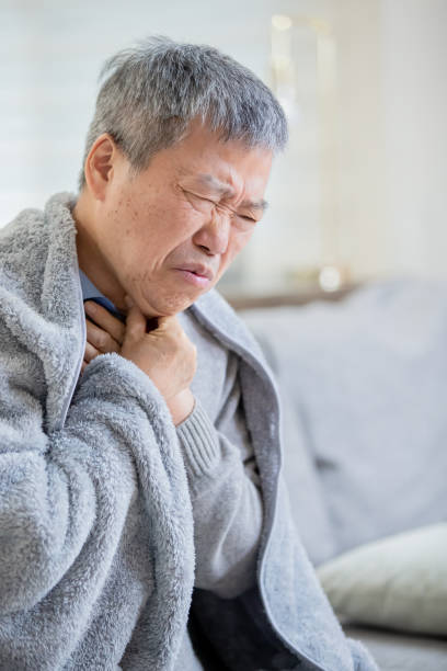 istock elderly man has sore throat 1184185653
